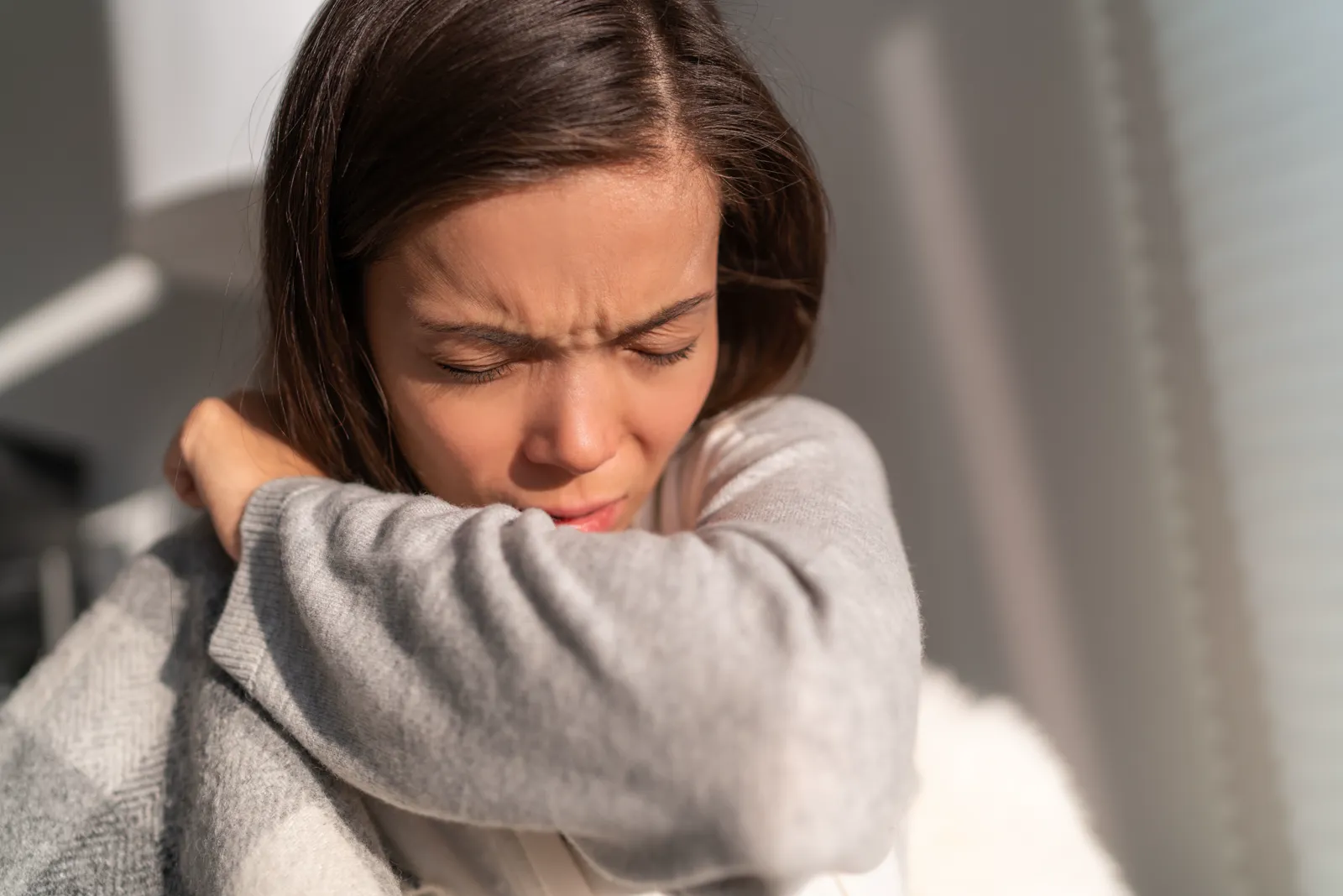 Woman with hay fever symptoms