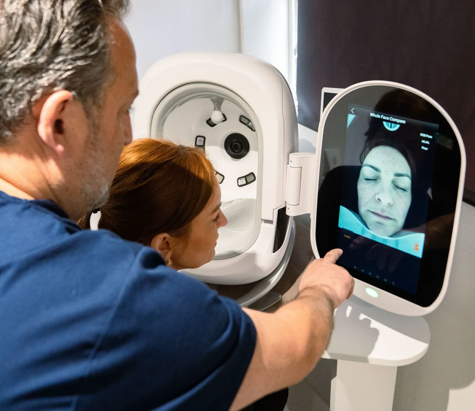 Practitioner reviewing a patient skin analysis